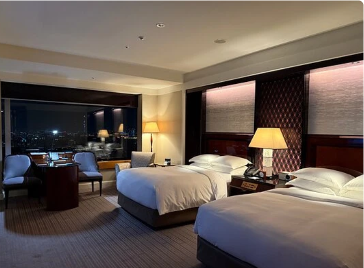 Crazy RITZ Tokyo room with two double beds